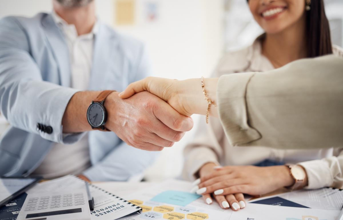 Business people, handshake and meeting in teamwork, hiring or partnership together at office. Close